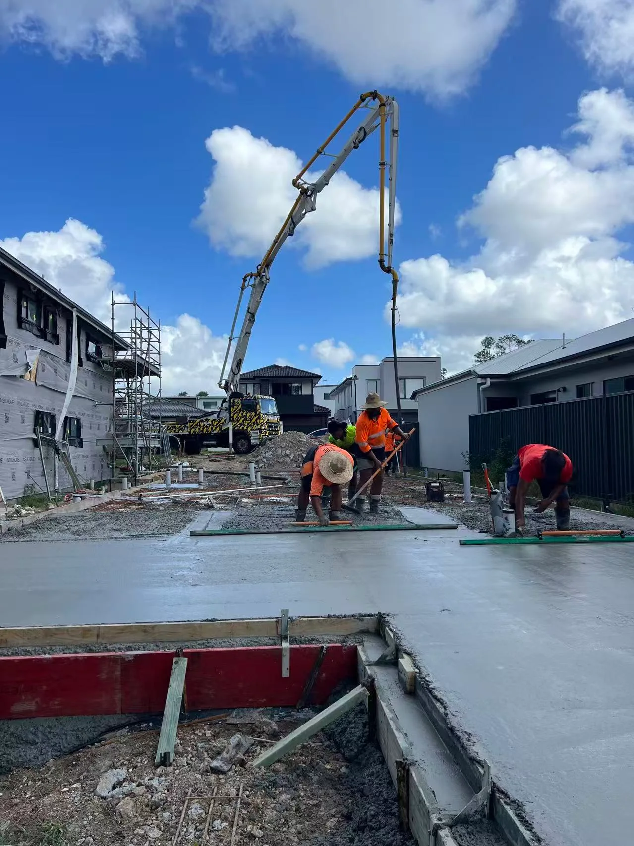 Concrete pour with workers on site